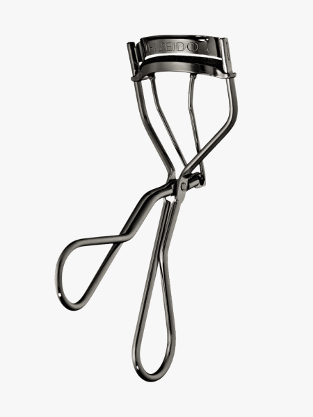 Shiseido Eyelash Curler in branded component on a light gray background
